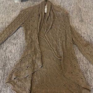 Tan cut-out cardigan sweater.